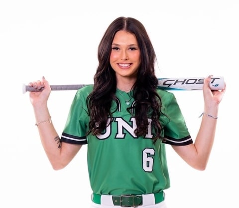 Elizabeth Moffitt in green UNT uniform with bat