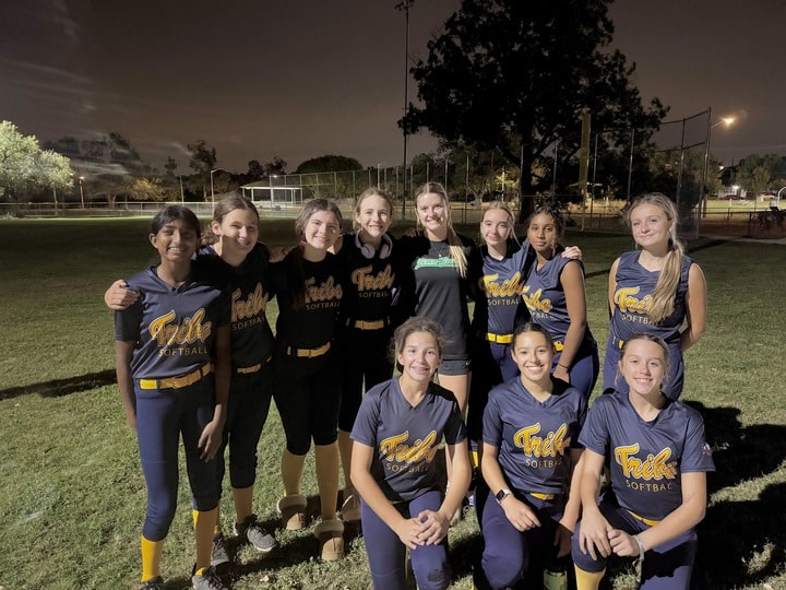 UNT softball team photo at night